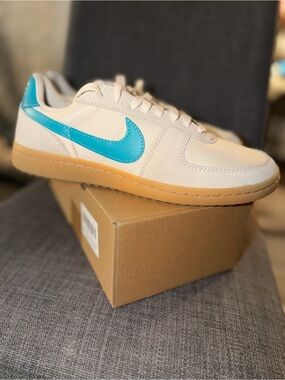 Nike men’s Field General  Low-Top Sneakers in Cream with Teal Swoosh